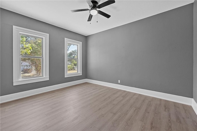 unfurnished room with ceiling fan and light hardwood / wood-style floors