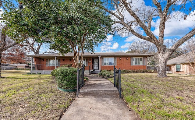 ranch-style home with a front lawn