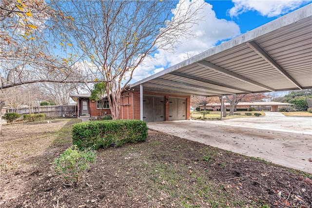 exterior space with a carport