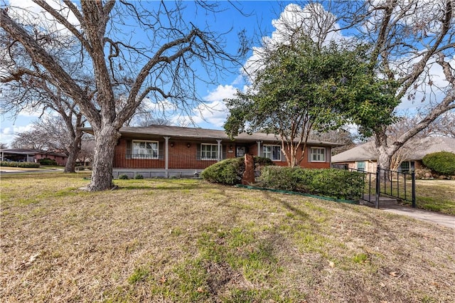 ranch-style house featuring a front lawn