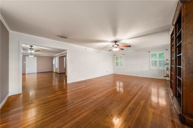 spare room with ornamental molding, hardwood / wood-style floors, and ceiling fan