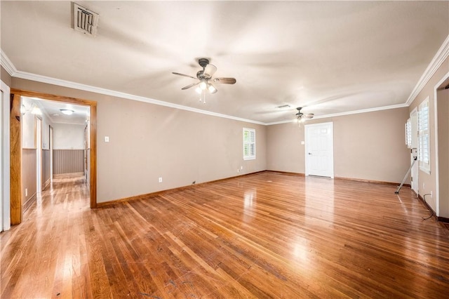 spare room with ceiling fan, ornamental molding, and light hardwood / wood-style floors