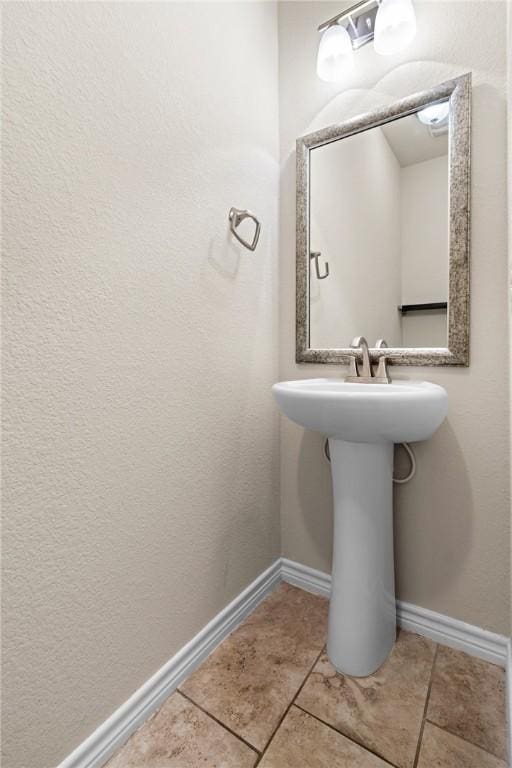 bathroom with tile patterned floors