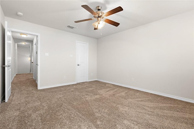 unfurnished bedroom featuring ceiling fan and carpet