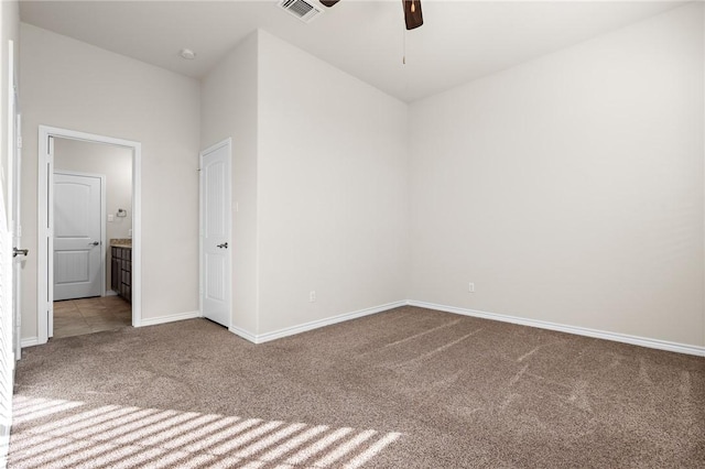 carpeted empty room with ceiling fan