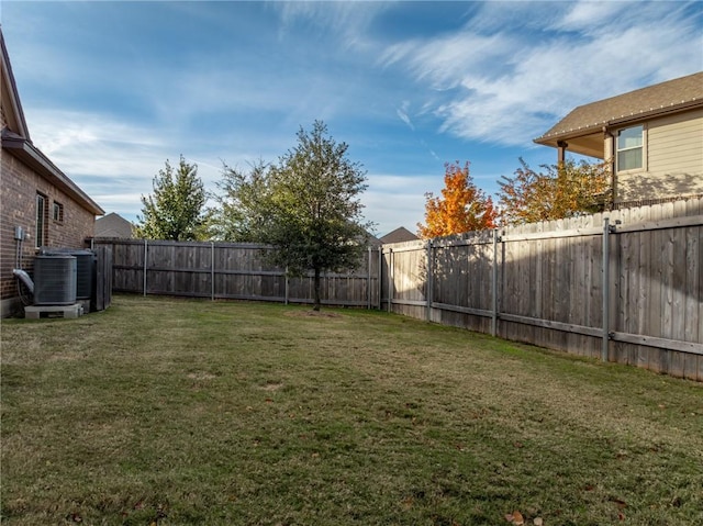 view of yard featuring central AC