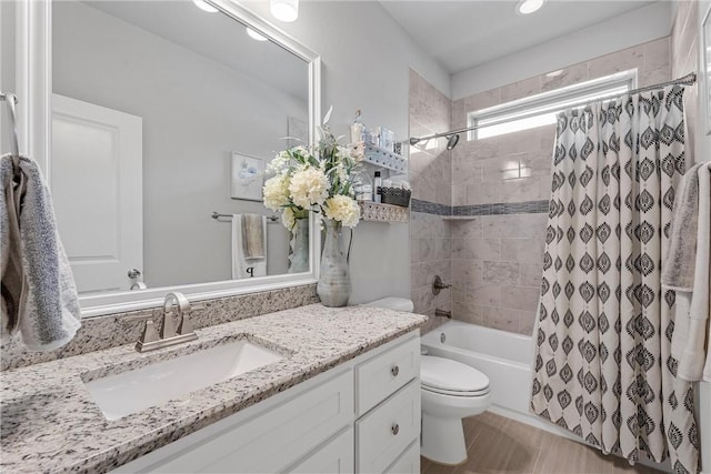 full bathroom with vanity, toilet, and shower / bathtub combination with curtain