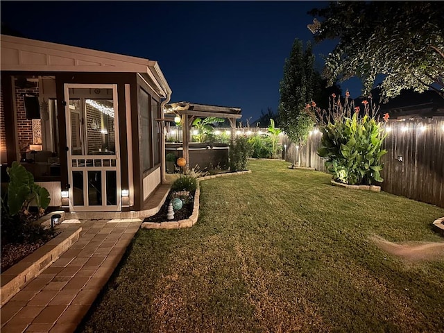 yard at twilight with a pergola