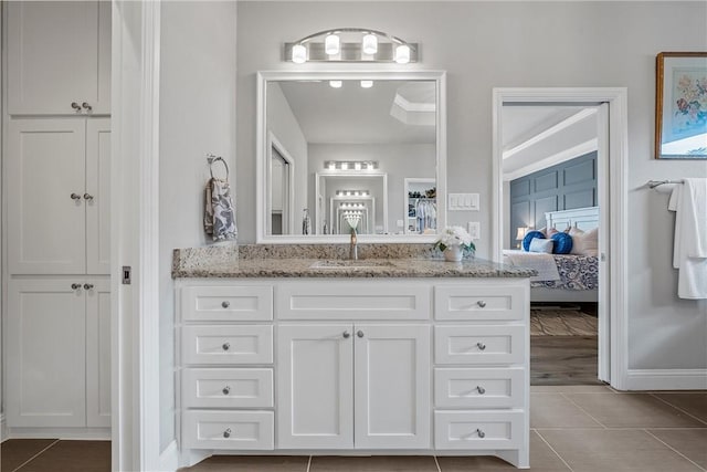 bathroom with tile patterned flooring and vanity