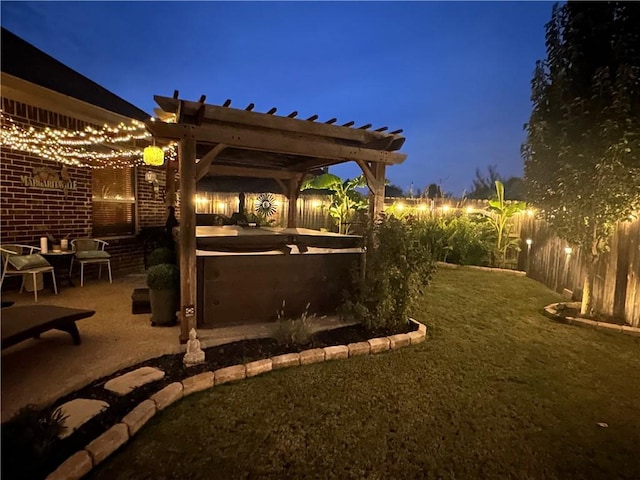 yard at dusk featuring a patio area and a pergola