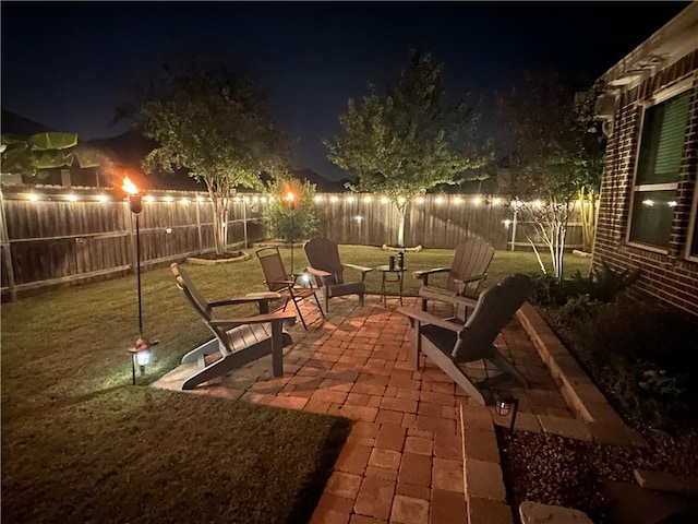 patio at night with a lawn