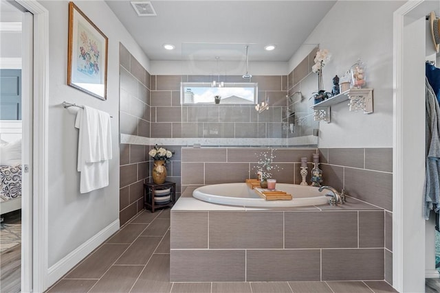 bathroom with tile patterned floors and plus walk in shower