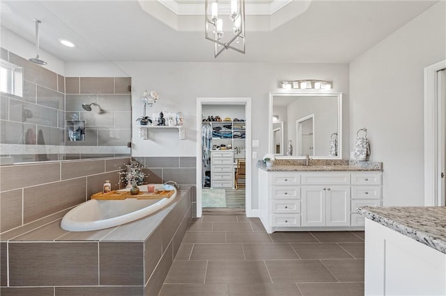 bathroom featuring tile patterned flooring, vanity, independent shower and bath, and crown molding