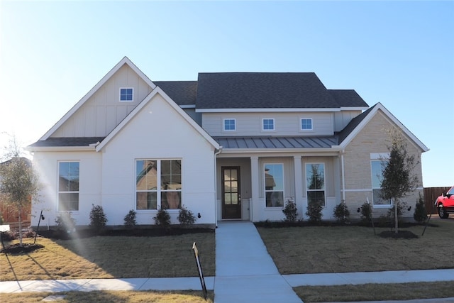 view of front of house featuring a porch and a front yard