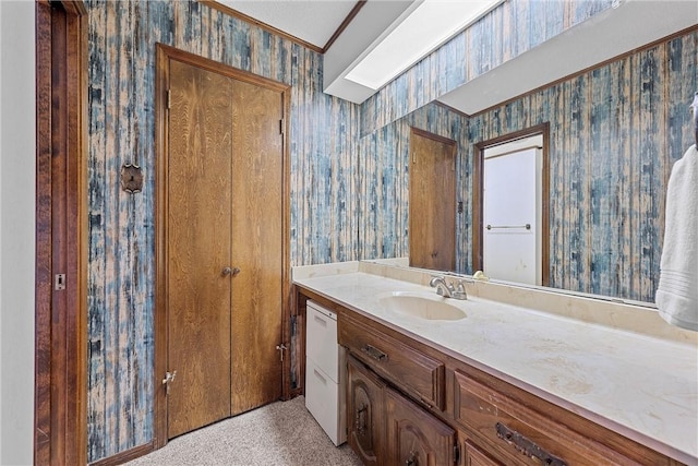 bathroom featuring vanity and crown molding