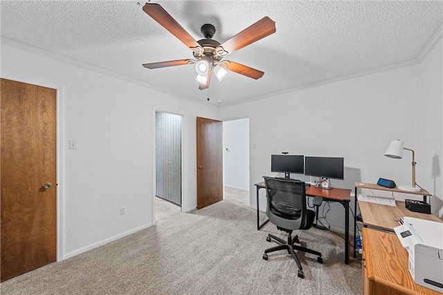 carpeted office space featuring ceiling fan and a textured ceiling