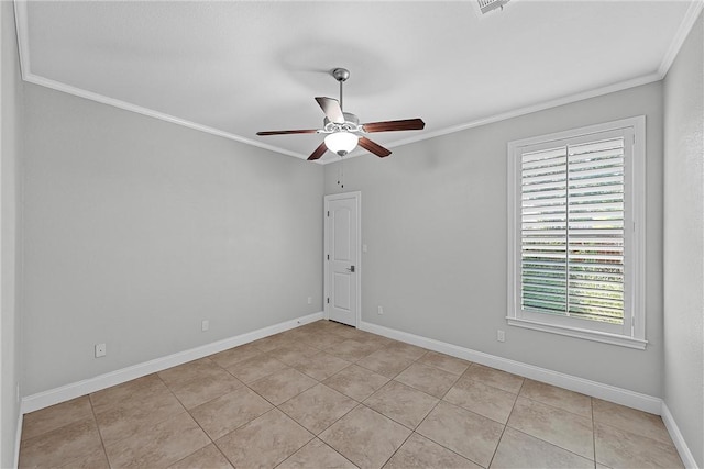 tiled spare room with ornamental molding and ceiling fan