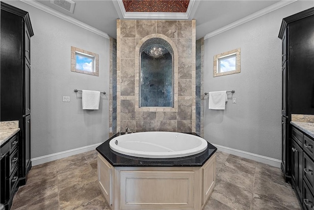 bathroom featuring vanity, crown molding, and a bathing tub