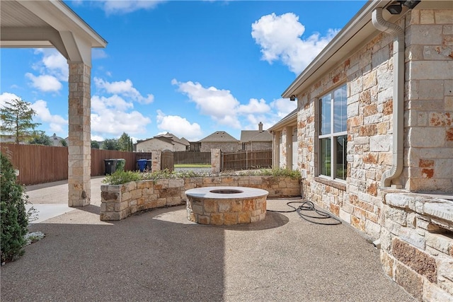 view of patio / terrace featuring an outdoor fire pit