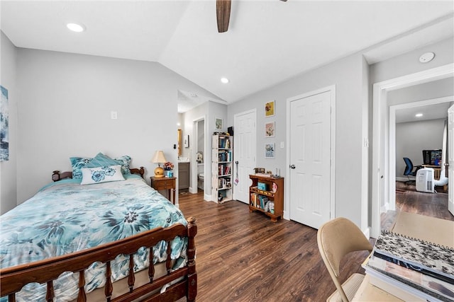 bedroom with lofted ceiling, dark hardwood / wood-style floors, ceiling fan, and ensuite bath