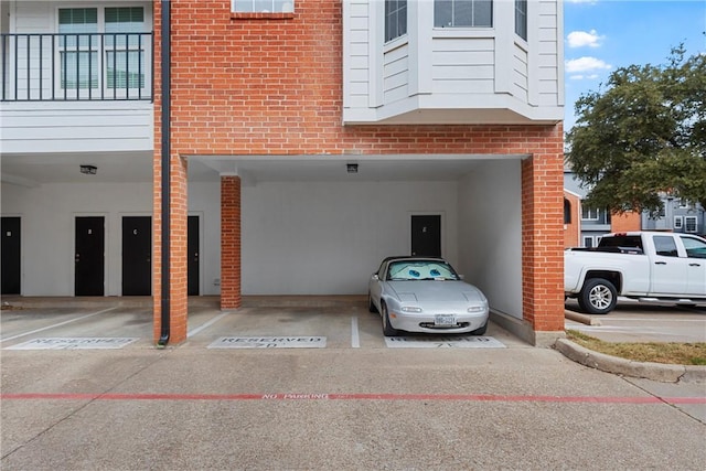 view of parking / parking lot with a garage