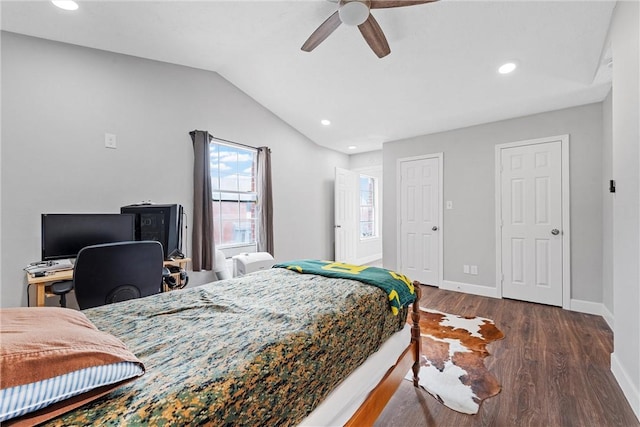 bedroom with vaulted ceiling, ceiling fan, and dark hardwood / wood-style flooring