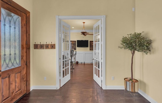 entryway with dark wood-style floors, french doors, baseboards, and ceiling fan