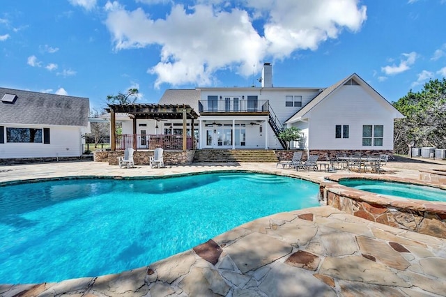 view of swimming pool featuring a patio, a pergola, and a pool with connected hot tub