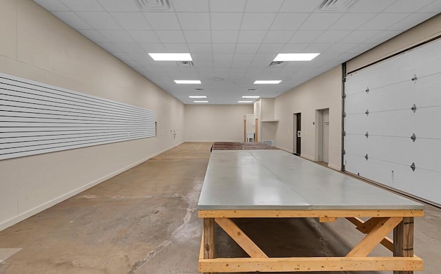 garage with visible vents and baseboards