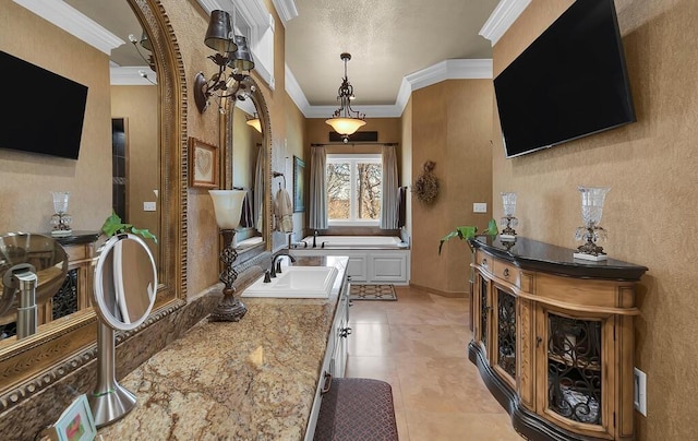 bathroom with ornamental molding and vanity