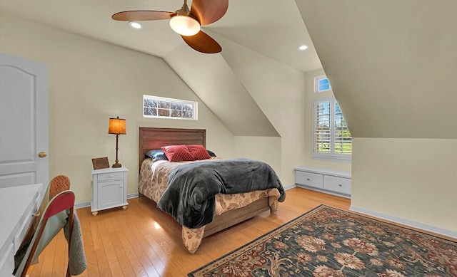 bedroom featuring a ceiling fan, baseboards, lofted ceiling, recessed lighting, and light wood-type flooring