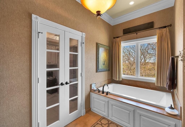 full bath with crown molding, a bath, french doors, and a textured wall