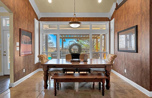 dining space featuring baseboards and ornamental molding