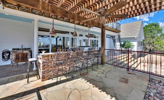 view of patio with outdoor dry bar