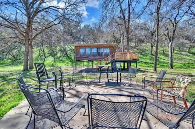 view of patio with a wooden deck and stairs