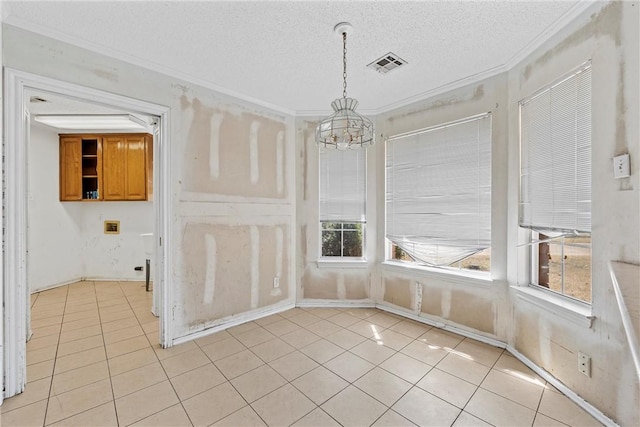 unfurnished dining area featuring ornamental molding, visible vents, and light tile patterned floors