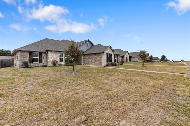 ranch-style house featuring a front lawn