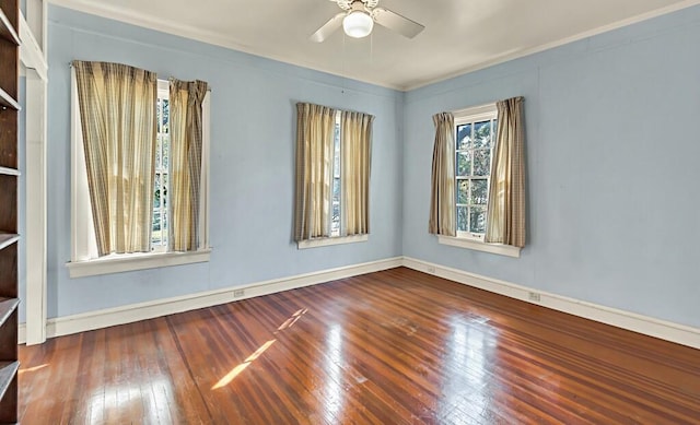 empty room with ceiling fan and hardwood / wood-style flooring