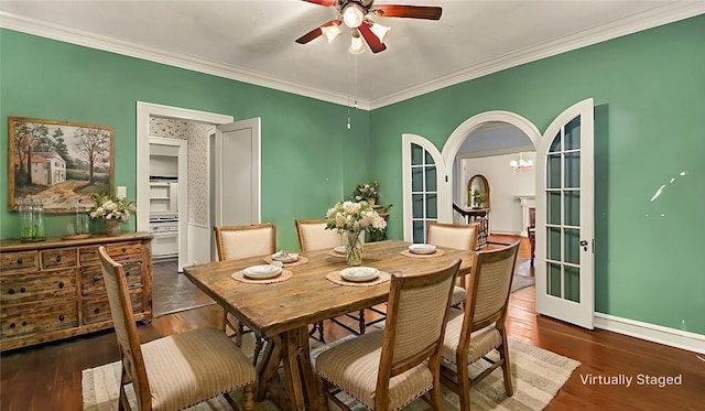 dining area featuring french doors, dark hardwood / wood-style floors, and ornamental molding