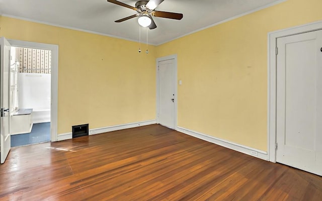 unfurnished room featuring hardwood / wood-style flooring, ceiling fan, ornamental molding, and baseboard heating