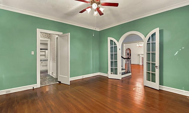 unfurnished room featuring dark hardwood / wood-style floors, crown molding, and french doors