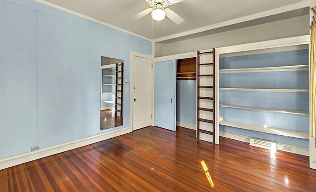 unfurnished bedroom featuring dark hardwood / wood-style flooring, a closet, ceiling fan, and crown molding