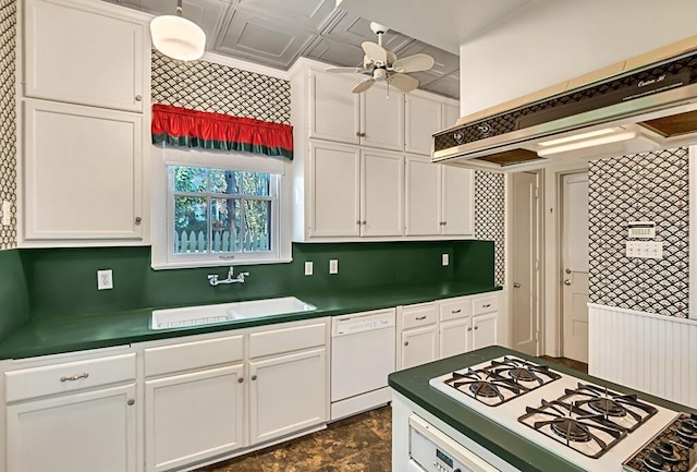 kitchen with premium range hood, white appliances, ceiling fan, sink, and white cabinetry