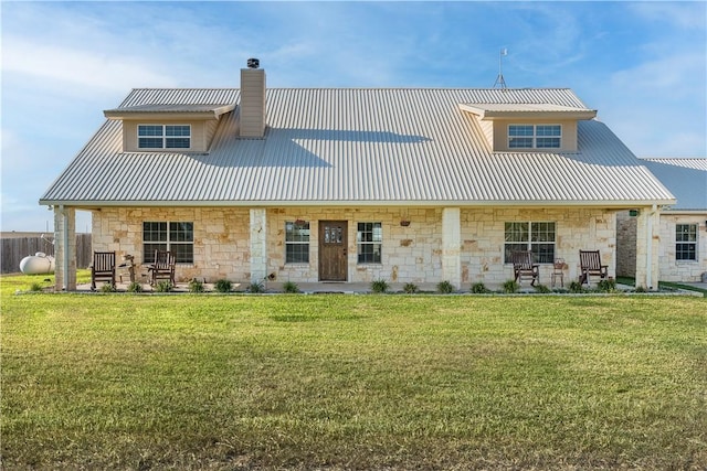 back of property featuring a yard