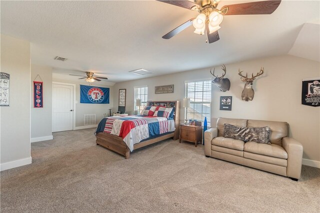 carpeted bedroom with ceiling fan and lofted ceiling