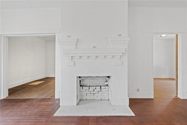 details with wood-type flooring and a fireplace