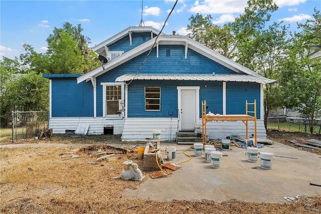 back of house with a patio