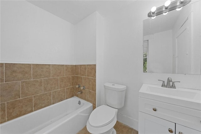 bathroom with tile patterned floors, vanity, toilet, and a bathing tub