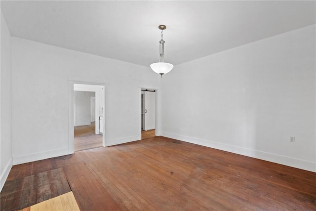 empty room featuring hardwood / wood-style flooring