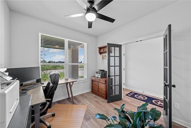 office area featuring french doors, ceiling fan, baseboards, and wood finished floors